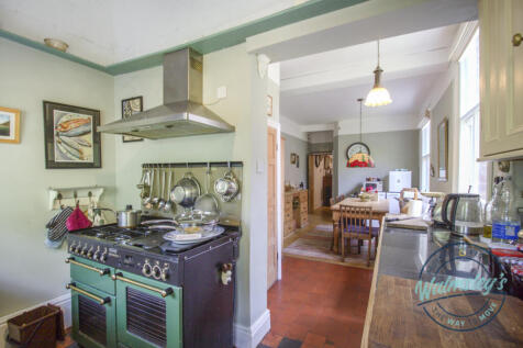 Kitchen with dining beyond