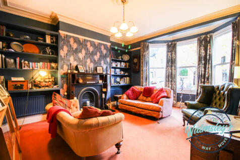 Sitting room with bay window &amp; fireplace
