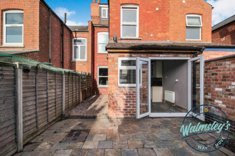 Rear patio with French doors to garden