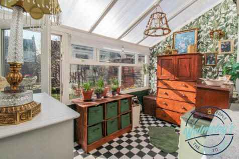 Conservatory with utility/cloakroom to rear