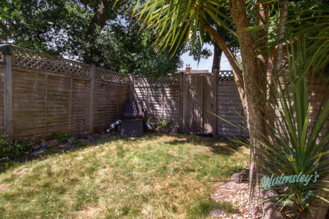 Rear of garden with gated entrance &amp; shed