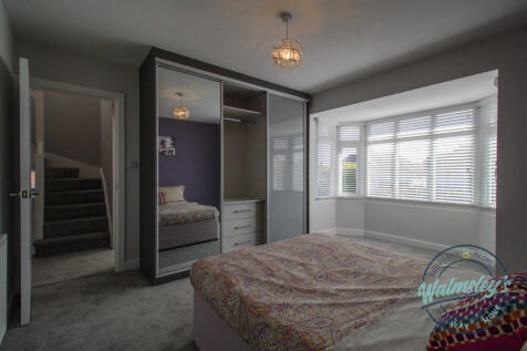 Bedroom two with fitted wardrobes