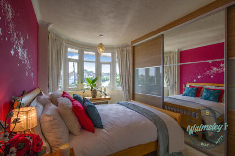 Bedroom two with fitted wardobes to frontage