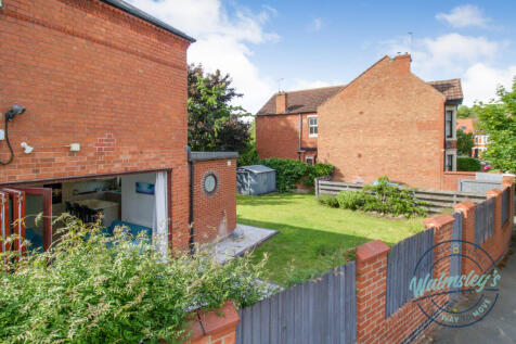 Rear gardens with gated driveway