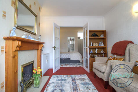 Front sitting room with bedroom four beyond