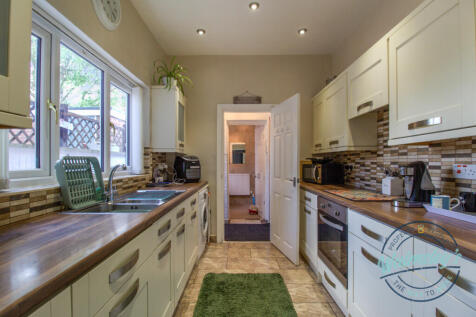 Kitchen towards rear lobby and bathroom