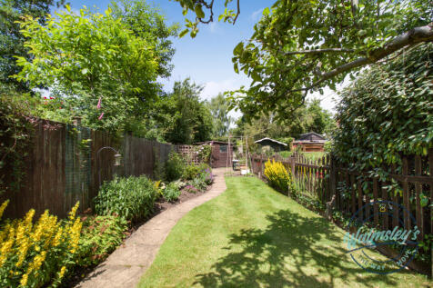 Rear garden with patio and shed to rear