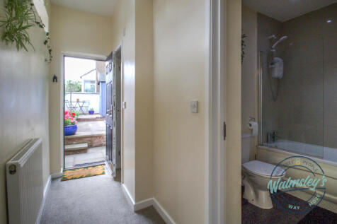 Rear entry towards two bathrooms