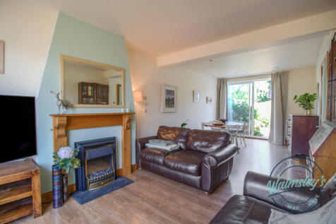 Sitting &amp; dining room with sliding doors to garden