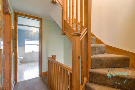 Staircase rising to 2nd floor