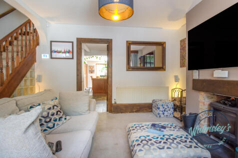 Sitting room through to kitchen
