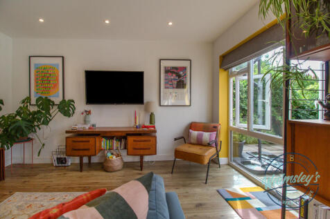 Bright &amp; characterful sitting room to rear
