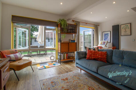 Sitting room with bi-folds and floor to ceiling wi
