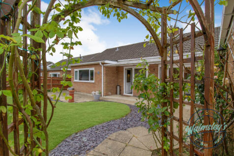Rear elevation through rose arch