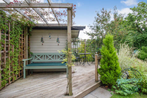 Decked sitting area and Summer house