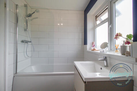 Bathroom with mains shower over bath
