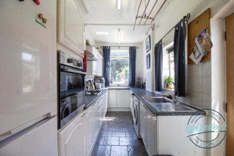 Kitchen with doorway to gardens