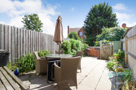 Rear South facing patio gardens