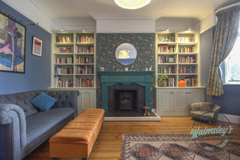 Front sitting room with log burner and bay