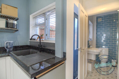 Kitchen towards rear lobby &amp; shower room