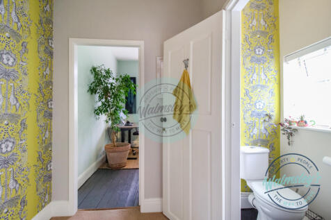 Lobby towards bedroom three with cloakroom