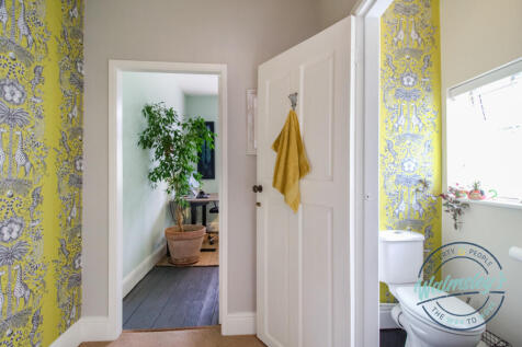 Lobby towards bedroom three with cloakroom