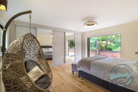 Main bedroom with fitted wardrobes &amp; bi folding do