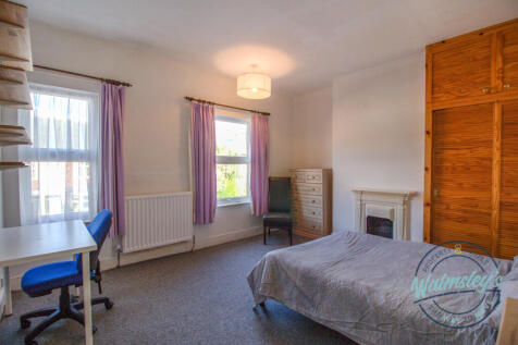 Main bedroom with fitted wardrobe