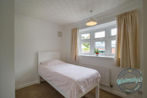 Bedroom to frontage with fitted wardrobes