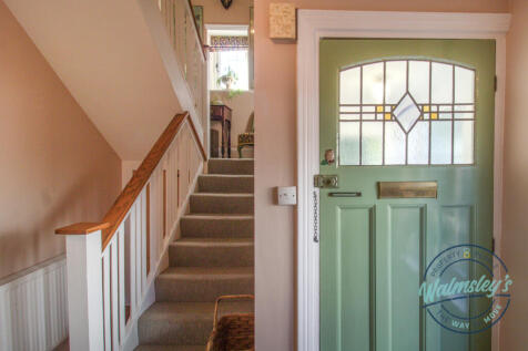 Hallway &amp; front door towards porch