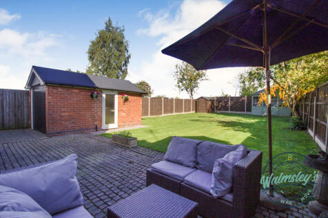 Private rear gardens with patio &amp; detached garage 