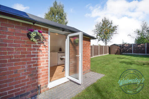 Detached garage now split to create utility room o