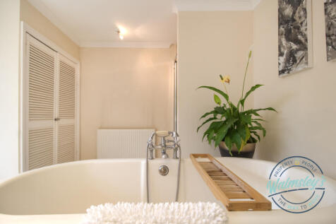 Free standing bath within family bathroom