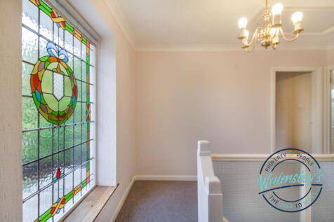 Landing with original stained glass feature window