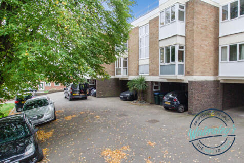 Close up frontage with garages under