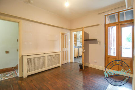 Rear sitting room with french doors to garden