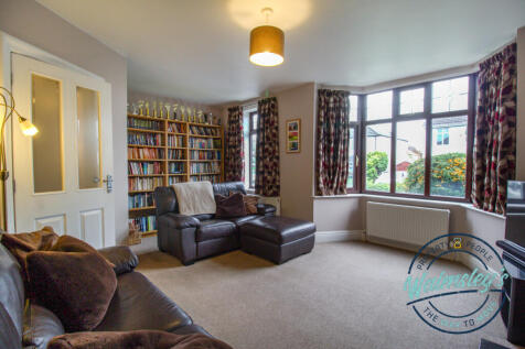Sitting room with bay & door to hallway