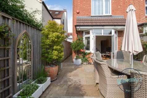 Rear elevation &amp; landscaped patios