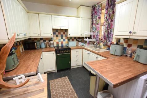 open plan kitchen &amp; dining room