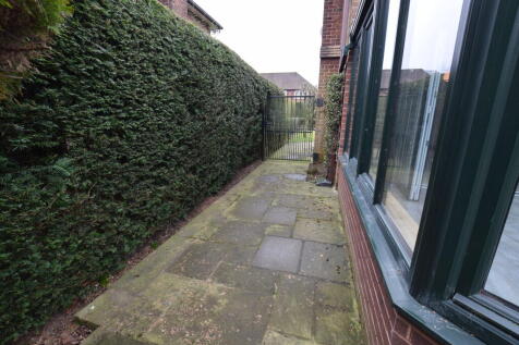 gated entrance to the rear garden