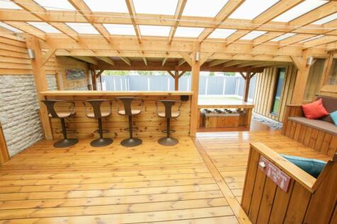 WOODED DECKED GARDEN AREA