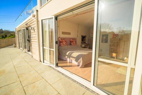 REAR PATIO TO BEDROOM