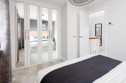 Main bedroom with storage in the Combe 2 bedroom home