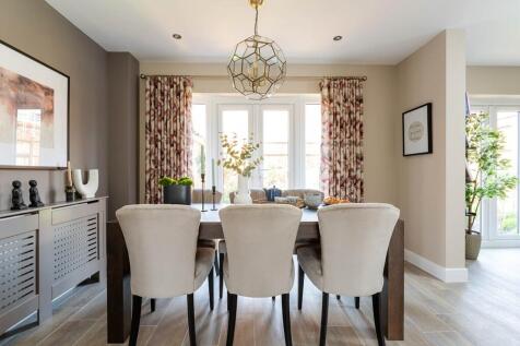 Traditional dining room with French doors to the rear garden