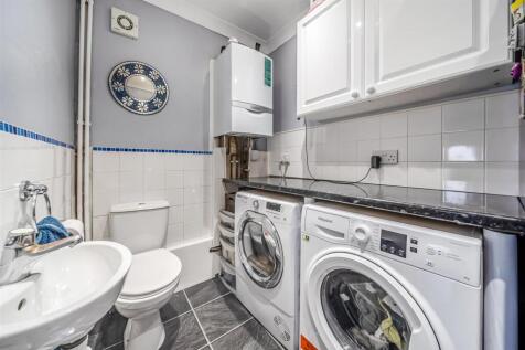 CLOAKROOM/UTILITY ROOM