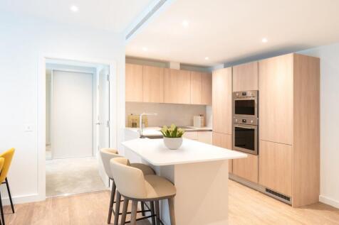 Explore this beautifully designed kitchen featuring top-notch appliances and contemporary cabinetry.