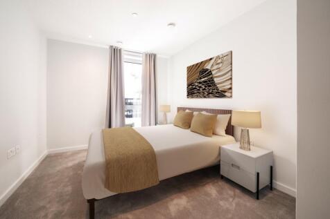 Experience serenity in this stylishly designed bedroom complete with modern amenities.