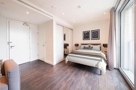 Experience the sophistication of this elegant bedroom retreat, bathed in natural light.