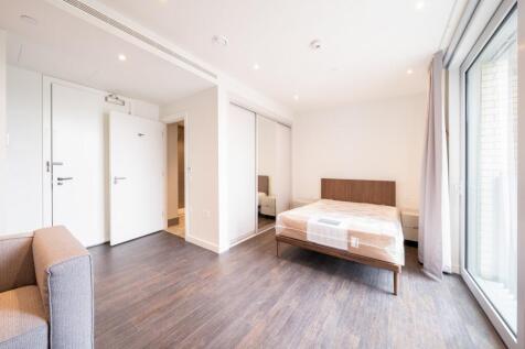 Experience the tranquility of this bright, modern bedroom featuring ample natural light and elegant design.