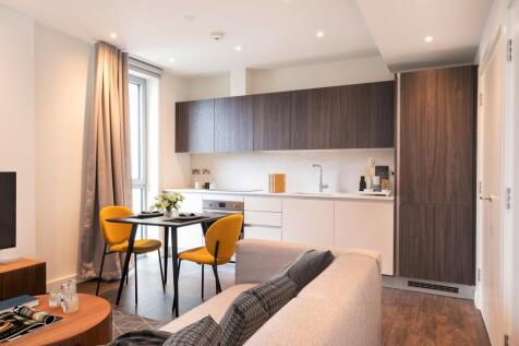 Experience the elegance of this chic urban kitchen and dining area, designed for modern living.